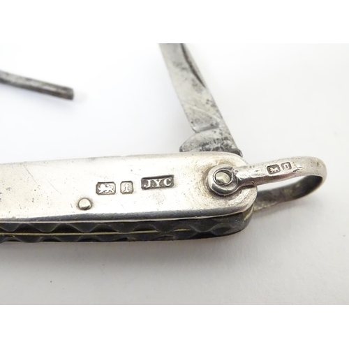 363 - A silver handled pocket knife with folding knife, scissors and button hook sections Hallmarked Sheff... 