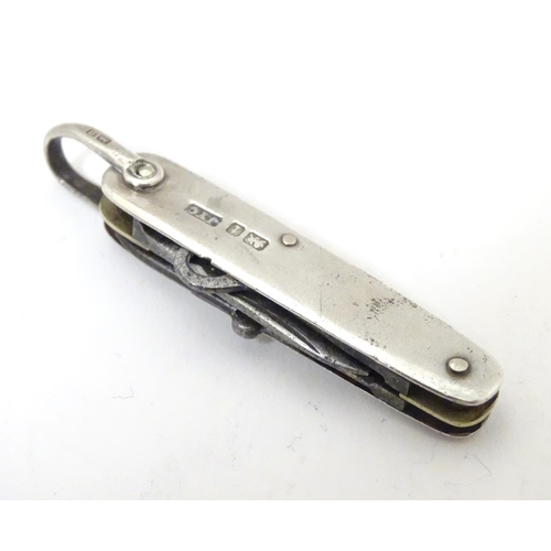 363 - A silver handled pocket knife with folding knife, scissors and button hook sections Hallmarked Sheff... 