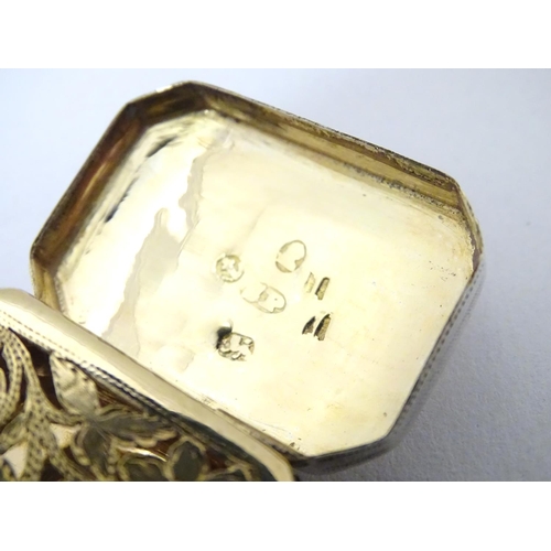 373 - A 19thC silver vinaigrette with engraved decoration to lid and a gilded interior, hallmarked Birming... 