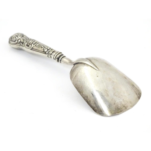 379 - A caddy spoon with shovel formed bowl hallmarked Birmingham c1827 maker IT.  4