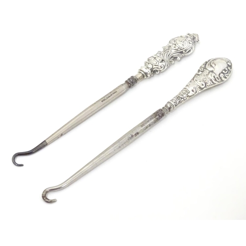 382 - Two silver handled button hooks, one with Art Nouveau decoration hallmarked Birmingham 1912 maker Ad... 