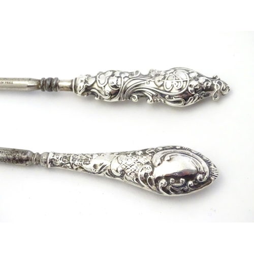 382 - Two silver handled button hooks, one with Art Nouveau decoration hallmarked Birmingham 1912 maker Ad... 