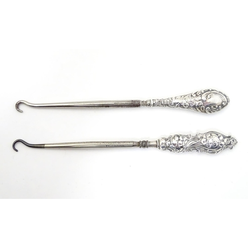 382 - Two silver handled button hooks, one with Art Nouveau decoration hallmarked Birmingham 1912 maker Ad... 