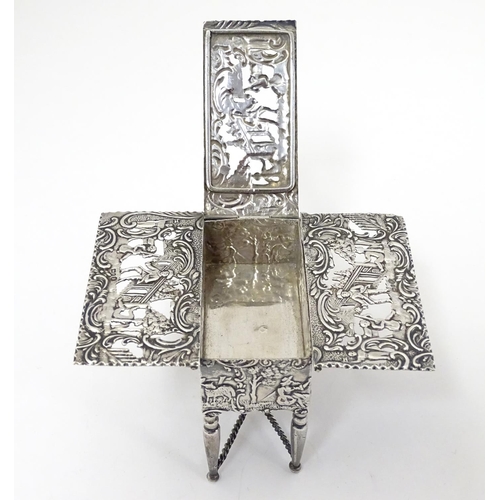 385 - A Continental silver novelty  pomander box formed as a drop flap table with figural and acanths deco... 