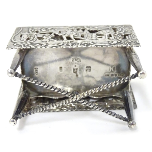 385 - A Continental silver novelty  pomander box formed as a drop flap table with figural and acanths deco... 