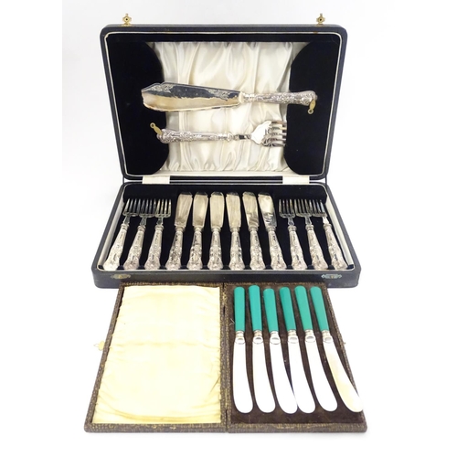 393 - A cased 6-place set of silver handled fish eaters with servers. The handles hallmarked Sheffield 193... 