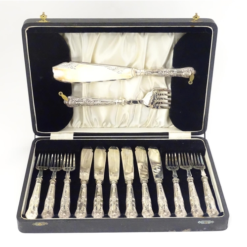 393 - A cased 6-place set of silver handled fish eaters with servers. The handles hallmarked Sheffield 193... 