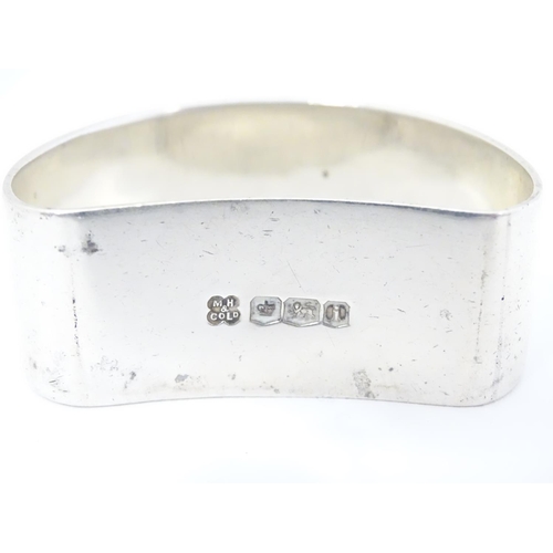 396 - A silver napkin ring of D shape hallmarked Martin Hall & Co Ltd