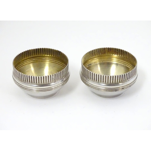 397 - A pair of American Sterling silver salts with gilded interiors. Maker Gorham Manufacturing Co. 1 3/4... 