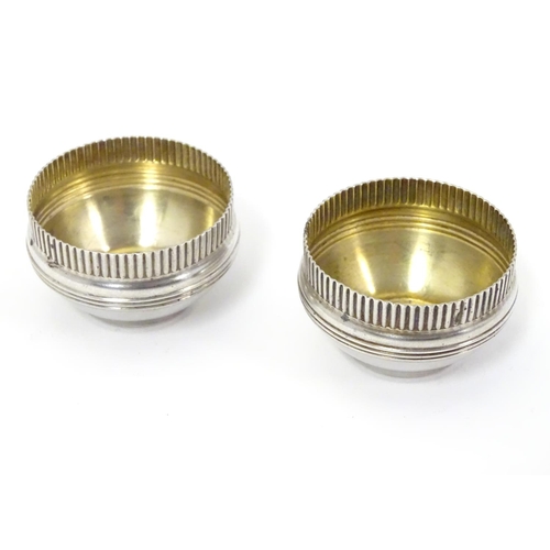 397 - A pair of American Sterling silver salts with gilded interiors. Maker Gorham Manufacturing Co. 1 3/4... 