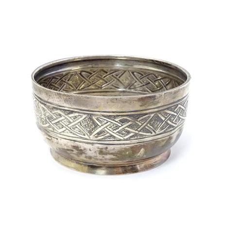 400 - A silver bowl with banded Arts and Crafts / Celtic style decoration. Hallmarked  Sheffield 1926 make... 