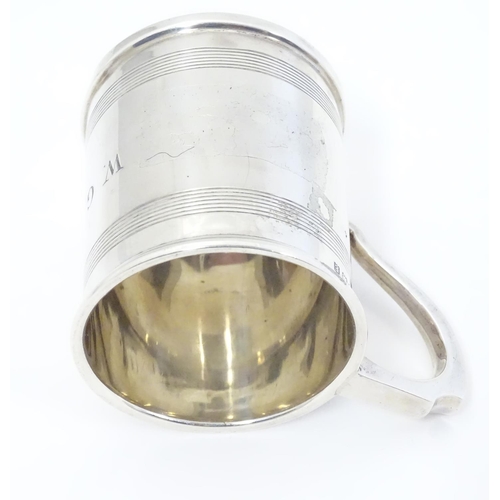 403 - An Art Deco silver tankard with banded decoration. Hallmarked Birmingham 1929 maker A & J Zimmerman ... 