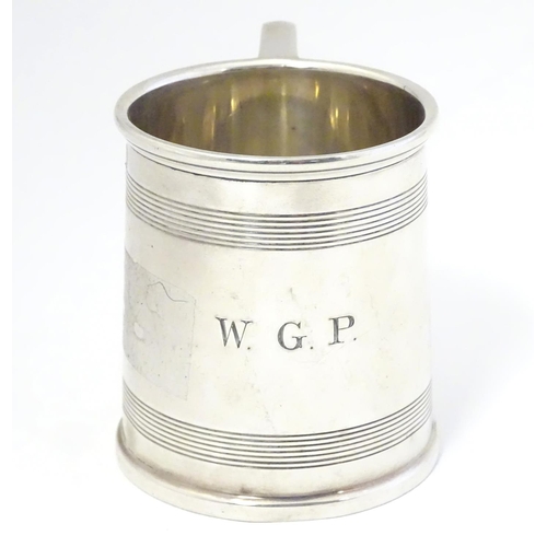 403 - An Art Deco silver tankard with banded decoration. Hallmarked Birmingham 1929 maker A & J Zimmerman ... 