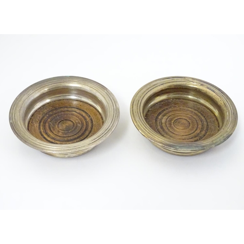 407 - A pair of silver plate small coasters with turned wooden bases 4 1/4