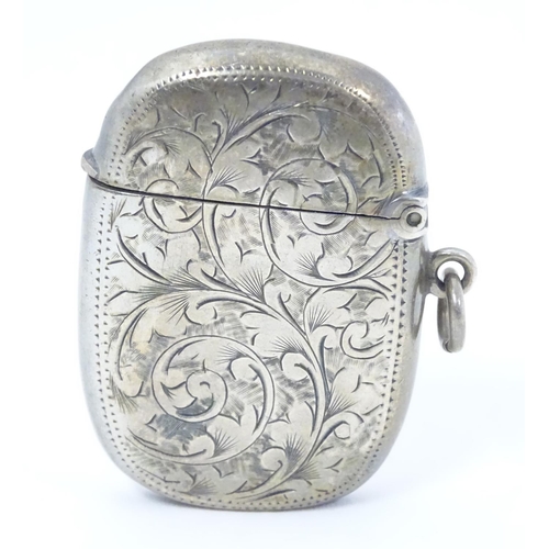 408 - A silver vesta case with engraved decoration maker Birmingham 1907 maker William M Hayes. 1 3/4