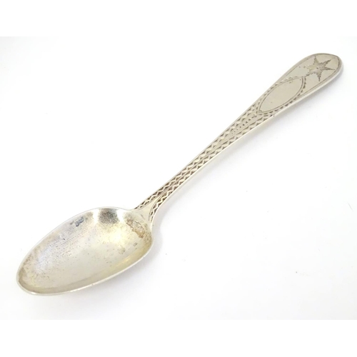 413 - An Irish silver  Star/ Celtic Point Pattern teaspoon.  Hallmarked Dublin maker John Smyth, and stamp... 