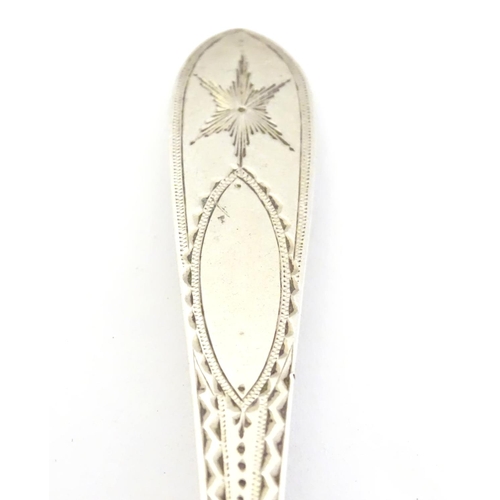 413 - An Irish silver  Star/ Celtic Point Pattern teaspoon.  Hallmarked Dublin maker John Smyth, and stamp... 