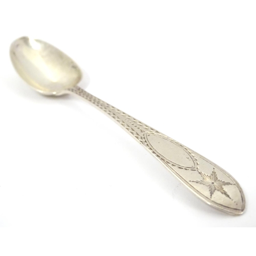 413 - An Irish silver  Star/ Celtic Point Pattern teaspoon.  Hallmarked Dublin maker John Smyth, and stamp... 