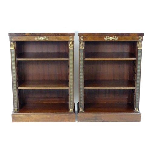 1372 - A pair of early 20thC Empire style mahogany bookcases, each having three shelves, gilt mounts and fl... 