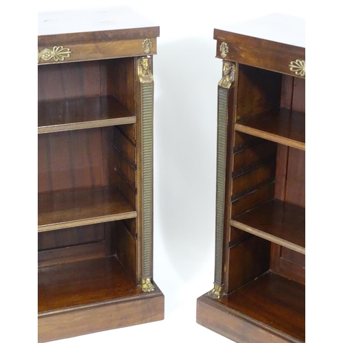 1372 - A pair of early 20thC Empire style mahogany bookcases, each having three shelves, gilt mounts and fl... 