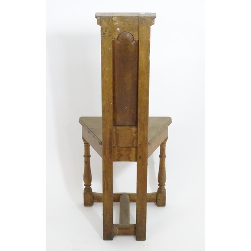 1392 - An early 20thC Arts and Crafts Shakespeare chair of oak construction , with a narrow panelled back a... 