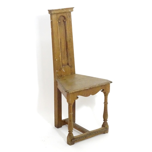 1392 - An early 20thC Arts and Crafts Shakespeare chair of oak construction , with a narrow panelled back a... 