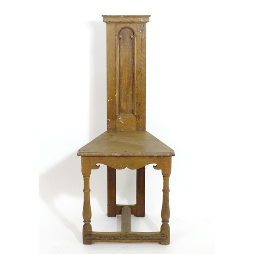 1392 - An early 20thC Arts and Crafts Shakespeare chair of oak construction , with a narrow panelled back a... 