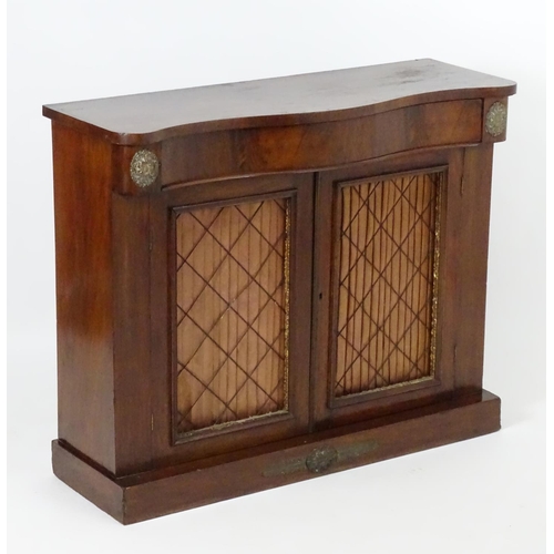 1393 - A mid / late 19thC mahogany chiffonier, with brass mounts flanking a single long drawer above two do... 