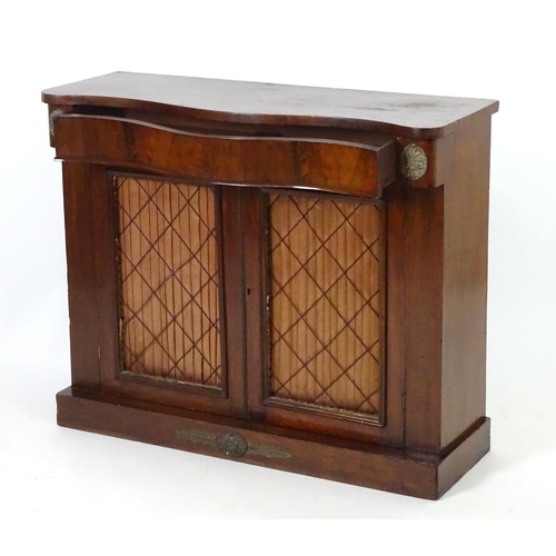 1393 - A mid / late 19thC mahogany chiffonier, with brass mounts flanking a single long drawer above two do... 