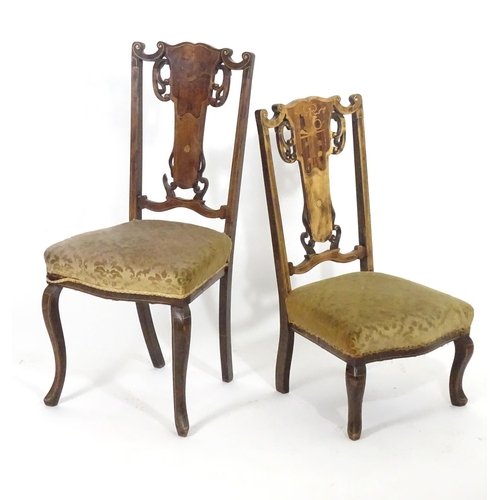 1555 - Two early 20thC side chairs with shaped top rails above tapered and pierced back splats with marquet... 