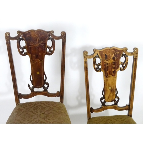 1555 - Two early 20thC side chairs with shaped top rails above tapered and pierced back splats with marquet... 