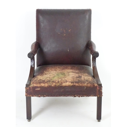 1557 - A mid / late 18thC Gainsborough open armchair  with swept arms having carved detailing and standing ... 