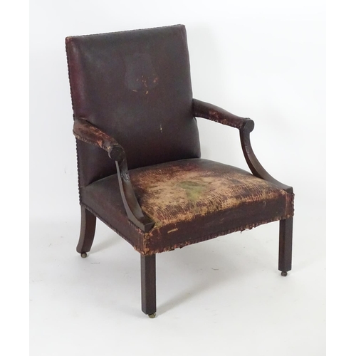 1557 - A mid / late 18thC Gainsborough open armchair  with swept arms having carved detailing and standing ... 