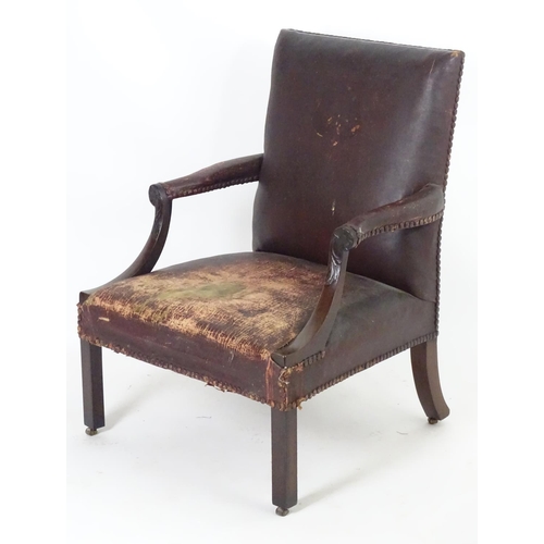 1557 - A mid / late 18thC Gainsborough open armchair  with swept arms having carved detailing and standing ... 