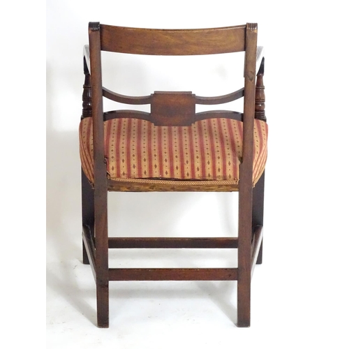 1558 - A Regency mahogany carver chair with a flame mahogany top rail and a shaped pierced mid rail, having... 