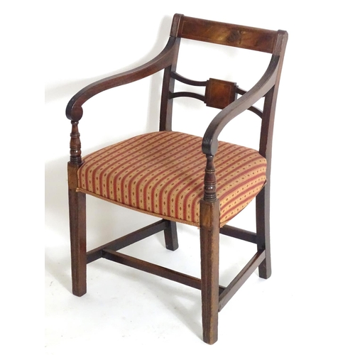 1558 - A Regency mahogany carver chair with a flame mahogany top rail and a shaped pierced mid rail, having... 