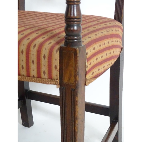 1558 - A Regency mahogany carver chair with a flame mahogany top rail and a shaped pierced mid rail, having... 