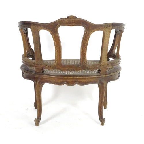 1559 - An early 20thC French Louis VI style chair with a carved and moulded frame above a caned seat, stand... 