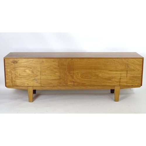 1565 - Vintage retro, mid-century: a large c1970 teak sideboard, in the Danish style, the three compartment... 