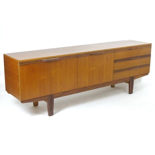 1565 - Vintage retro, mid-century: a large c1970 teak sideboard, in the Danish style, the three compartment... 