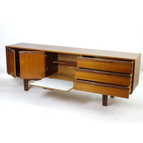 1565 - Vintage retro, mid-century: a large c1970 teak sideboard, in the Danish style, the three compartment... 