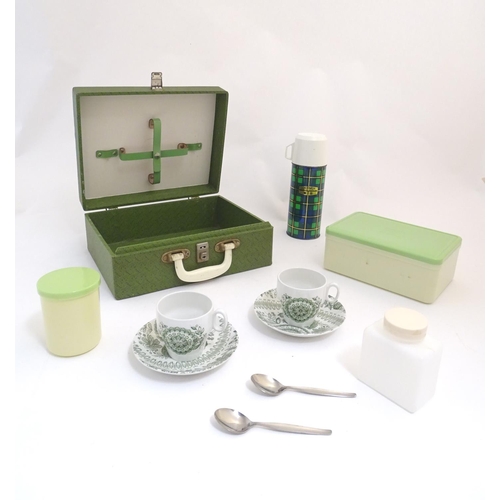 1345 - A mid 20thC picnic set with thermos flask, Brexton container and etc. The case 12