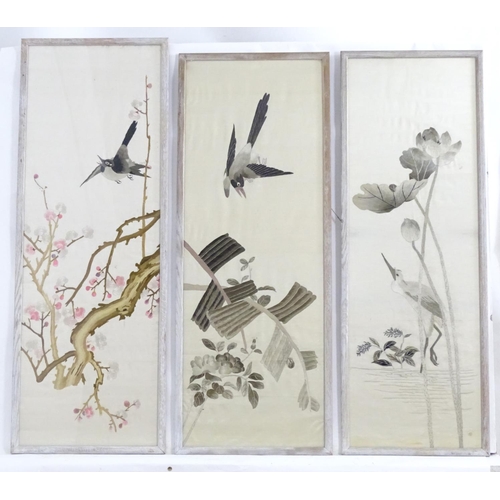 1360 - Three 20thC Chinese embroideries, comprising a bird in flight above branches of blossom, a crane in ... 