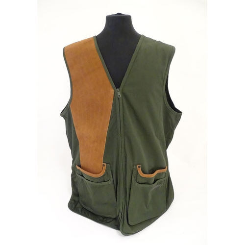 2029 - Sporting / Country pursuits: A Musto skeet vest / clay shooting gilet in green. Size XXL, new with t... 