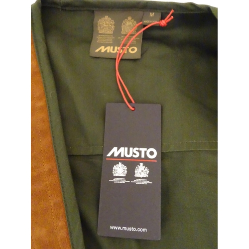 2031 - Sporting / Country pursuits: A Musto skeet vest / clay shooting gilet in green. Size M, new with tag... 