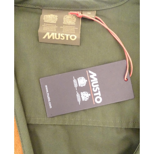 2032 - Sporting / Country pursuits: A Musto skeet vest / clay shooting gilet in green. Size M, new with tag... 