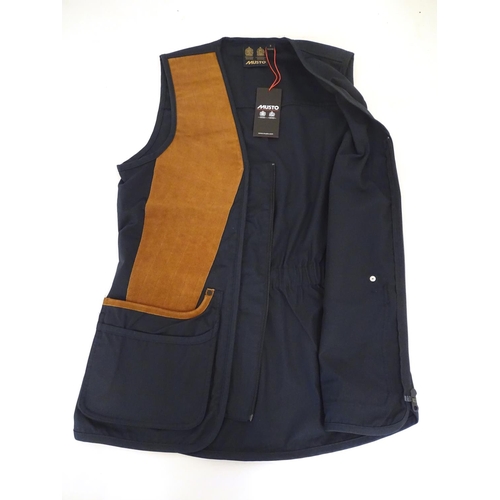 2033 - Sporting / Country pursuits: A Musto skeet vest / clay shooting gilet in Navy. Size M, new with tags... 