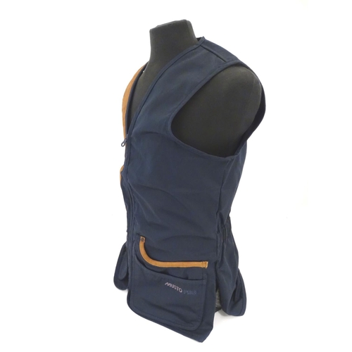 2033 - Sporting / Country pursuits: A Musto skeet vest / clay shooting gilet in Navy. Size M, new with tags... 