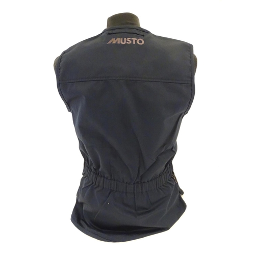 2033 - Sporting / Country pursuits: A Musto skeet vest / clay shooting gilet in Navy. Size M, new with tags... 