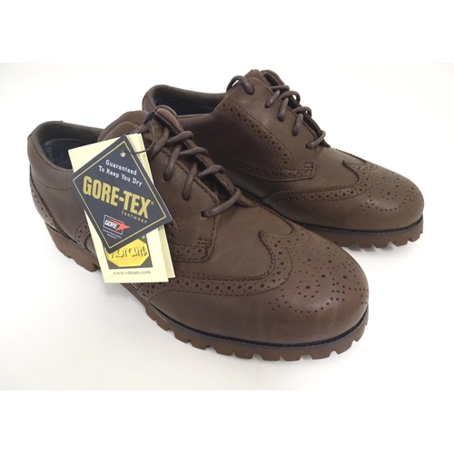 2036 - Sporting / Country pursuits: A pair of Musto, Gore-Tex brogues in dark brown, UK size 5, new with ta... 